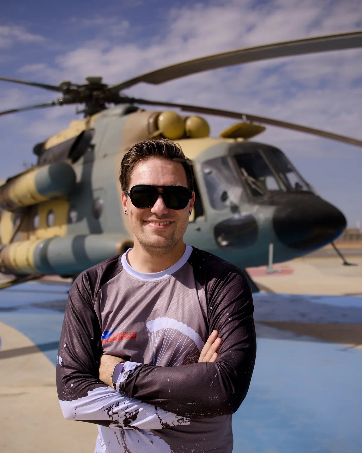 Braden Roseborough portrait near helicopter